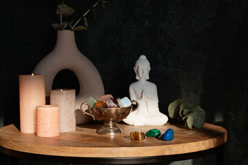 Buddha statue, candles and gemstones. Balance and calm energy flow at home, purifying the air, decrease stress level concept