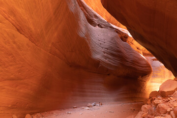 Moqui steps carved into a sandstone cliff anciently are still visible in Peekaboo Canyon in Utah. The floor of the canyon has eroded several feet more since the steps were carved.