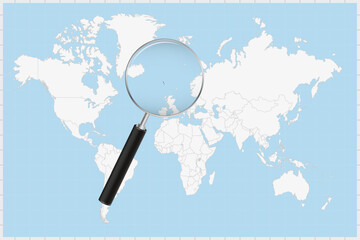 Magnifying glass showing a map of Faroe Islands on a world map.