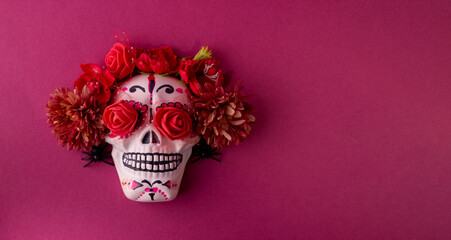 Dia De Los Muertos or Day of the Dead Celebration Background. Skull Decorated with Pink Dahlia flowers and roses in the eyes. Mexican Traditional Festive.