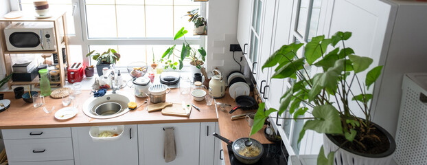 A mess in the kitchen, dirty dishes on the table, scattered things, unsanitary conditions. kitchen...