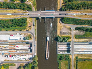 Topdown view of an navigable aquaduct under construction with ships 