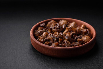 Delicious champignon mushrooms with salt, spices and herbs
