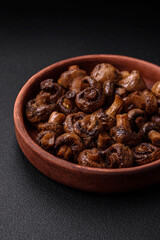 Delicious champignon mushrooms with salt, spices and herbs