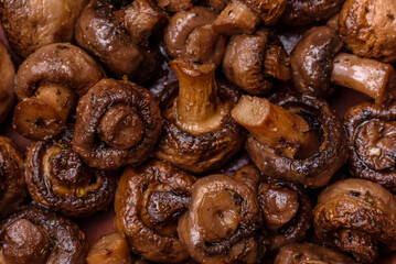 Delicious champignon mushrooms with salt, spices and herbs