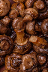Delicious champignon mushrooms with salt, spices and herbs