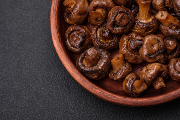 Delicious champignon mushrooms with salt, spices and herbs