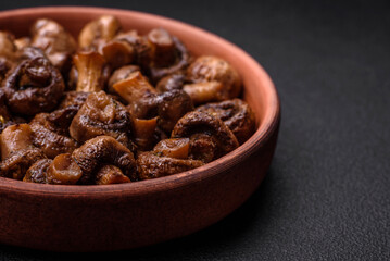 Delicious champignon mushrooms with salt, spices and herbs