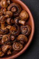 Delicious champignon mushrooms with salt, spices and herbs