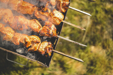 Man hand grilling barbecue with smoked pork at backyard on day. Family dinner outdoor style bbq activity