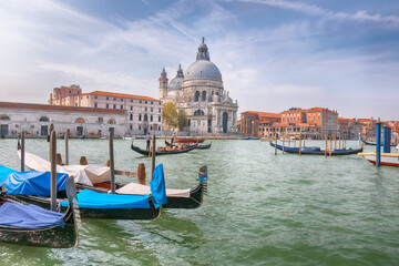 Fototapeta na wymiar Fabulous morning cityscape of Venice with famous Canal Grande and Basilica di Santa Maria della Salute church.
