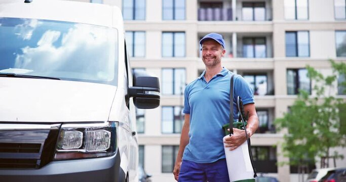 Confident Pest Control Worker Wearing Cap Against