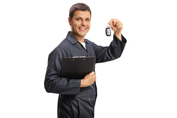 Auto mechanic holding a clipboard and car keys