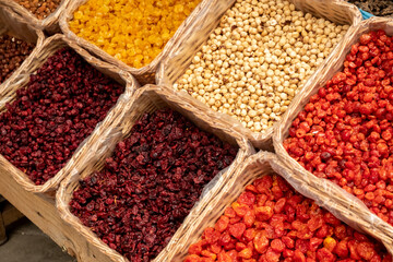 Assortment of nuts and dried fruits at the farmers market. Side view.