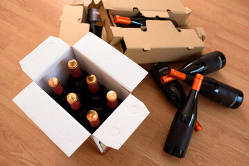 Cardboard box with quality wine bottles sent by post
