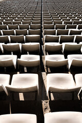 Detail of the empty stands of a large sports stadium, without attendees.