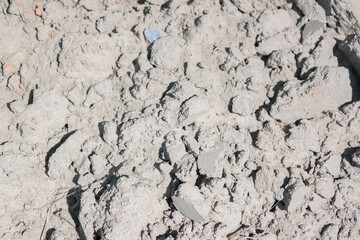 Sand in the details. Close up of dirty sand. Dry soil surface