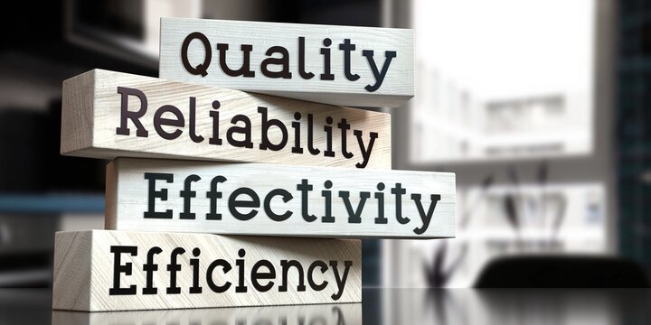 Quality, reliability, effectivity, efficiency - words on wooden blocks - 3D illustration