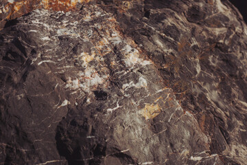 Texture cracked rock formation rock in the wild. Rocky cliff. Abstract Stone texture. Steep cliff of high mountain. Nature background, geological structure. Marble rocks in the wild. Detail Of Granite