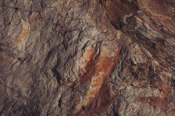 Texture cracked rock formation rock in the wild. Rocky cliff. Abstract Stone texture. Steep cliff of high mountain. Nature background, geological structure. Marble rocks in the wild. Detail Of Granite