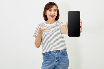 Cute asian short brunette hair woman promotes smartphone app, woman blogger showing personal social media page hold phone look camera happily smiling on white background