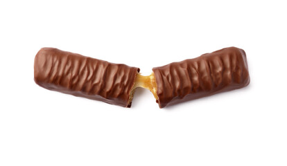 Pieces of chocolate bar with caramel on white background, top view