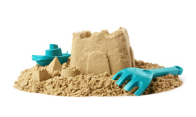 Beautiful sand castle and plastic beach toys isolated on white. Outdoor play