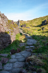Stone path at Djúpalónssandur black sand beach on a sunny day, Iceland