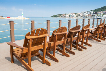 Terrace with a view on sea and sunset. Lounge chair in a sunlight.