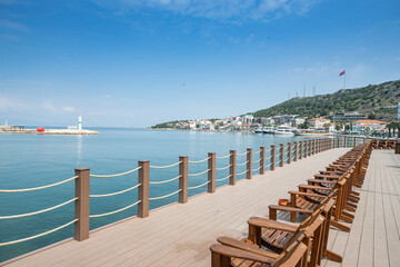 Terrace with a view on sea and sunset. Lounge chair in a sunlight.