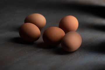 eggs on wooden table. Dark photo