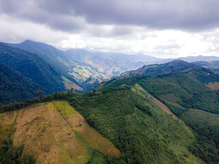 Shot from a drone camera angle at the Sky Road. Road 1256, Unseen Road, Nan Province, Thailand. It winds along the ridge of the forest. very beautiful view The rainy season will be green