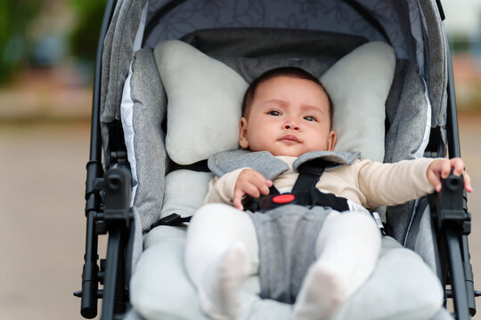 infant baby sitting in stroller