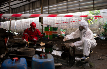 Worker or scientist industry wearing protective safety uniform, white glove and gas mask under...