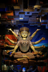 Idol of Goddess Devi Durga at a decorated puja pandal in Kolkata, West Bengal, India. Durga Puja is...