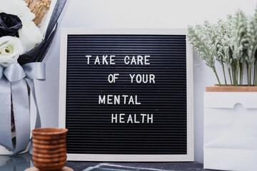 Letterboard with the words, Take care of your mental health. Mental health awareness concept