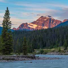 Edith Cavell mountain at sunrise by Athabasca River, Jasper national park, Canada.