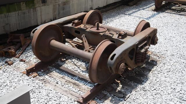 Wide shot of old train wheels.