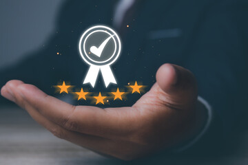 Man holding quality assurance, Guarantee, Standards, ISO certification and standardization. Quality...