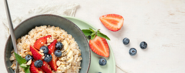 Healthy homemade oatmeal with berries for breakfast.