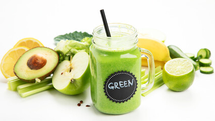 Healthy green smoothie  in a jar mug  on white background