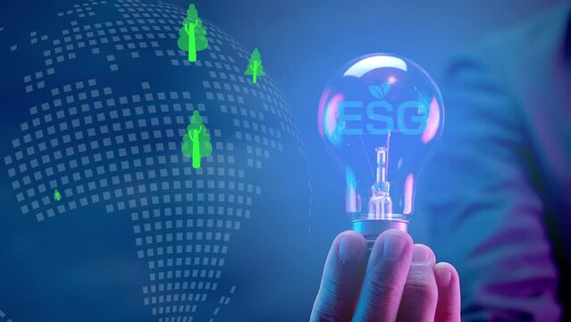 Businessman showing light bulb with ESG icons and virtual tree. Net zero greenhouse gas emissions target. Climate neutral long term strategy. Ecological, renewable energy and save environment concept.