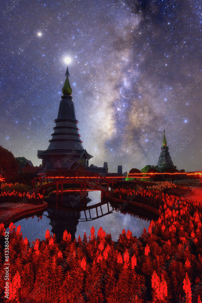 Wall mural spectacular milky way over a sacred temple at doi inthanon national park, chiang mai, thailand.
