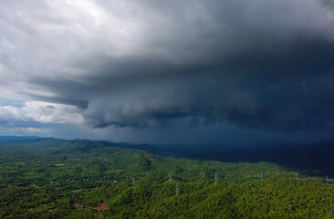 Aerial view rain storms and black clouds moving over the mountains In the north of Thailand, Pang Puai, Mae Moh, Lampang, Thailand.