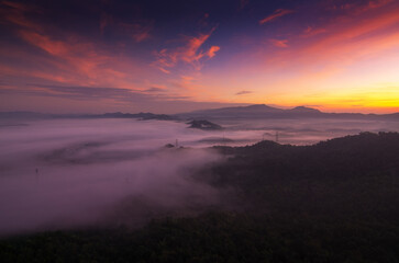 Fototapeta na wymiar Beautiful scenery at sunrise with fog from the top of Doi Pha Phueng, Ban Pang Puai, Mae Moh, Lampang Province, Thailand.
