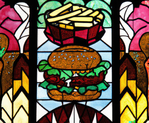 Gourmet stained glass artistry: A stunning window design featuring an intricately crafted hamburger and golden french fries, adding a unique and appetizing touch to any space Generative AI