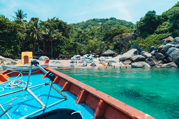  traveling on a long-tail boat on the bay at Koh Tao