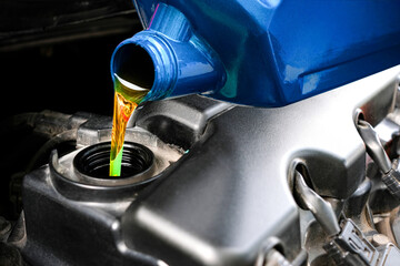 Refueling and pouring oil quality into the engine motor car Transmission and Maintenance Gear .Energy fuel concept.