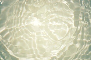 Blue water with ripples on the surface. Defocus blurred transparent blue colored clear calm water surface texture with splashes and bubbles. Water waves with shining pattern texture background.