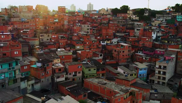 Aerial view over colorful favela houses, sunset in a the Villa Lobos ghetto, in Sao Paulo, Brazil